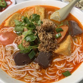 Tomato Broth Rice Noodle Soup with Tofu and Herbs